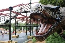 Children laughing on an adventure ride at Roarr! Dinosaur Adventure, the ultimate family day out for dinosaur fans near Hays Wood Retreat in Norfolk.