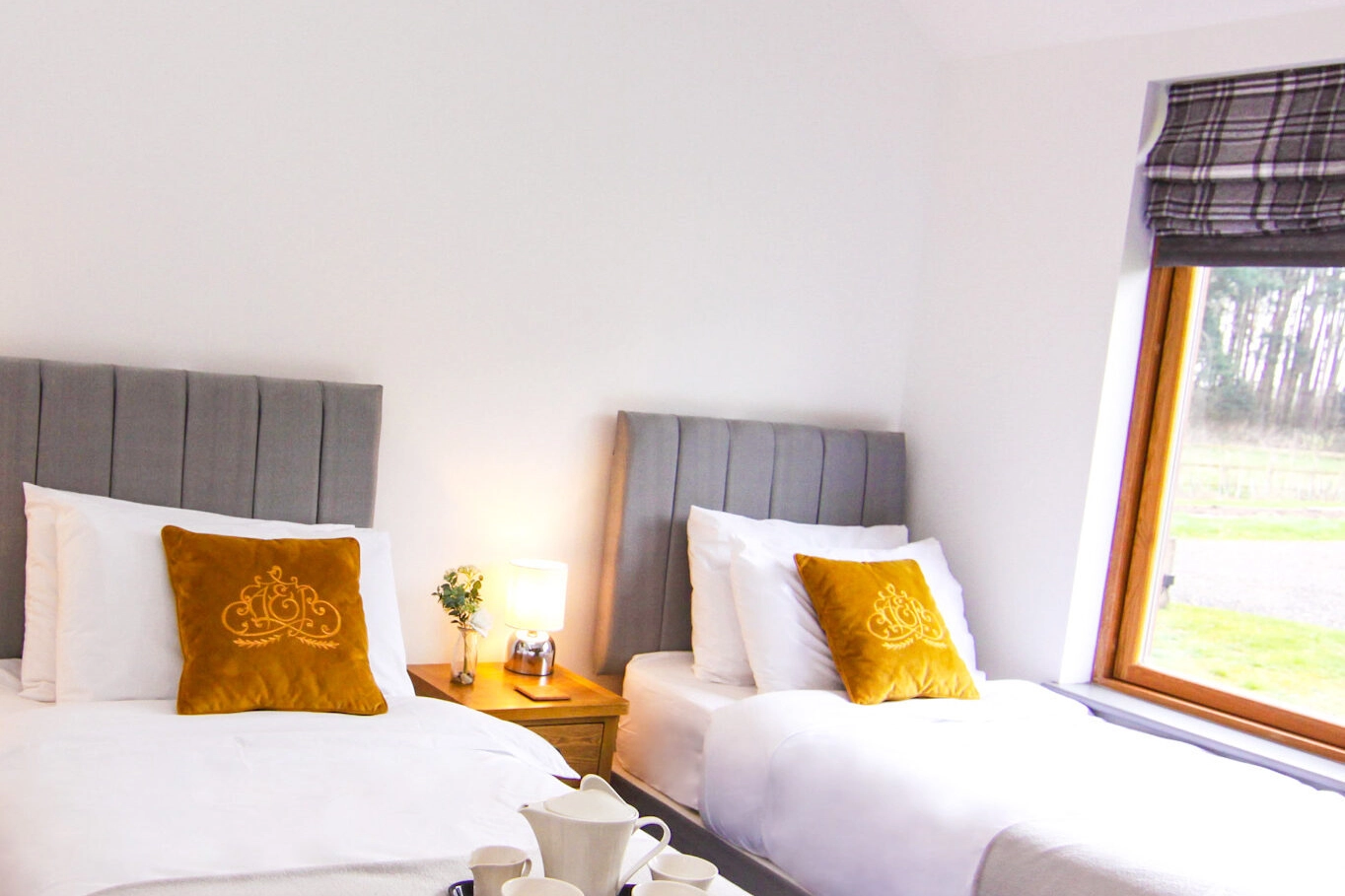 A ground-floor twin room with double beds at our lodge in Norfolk, providing accessible and comfortable accommodation with easy access to the surrounding countryside.