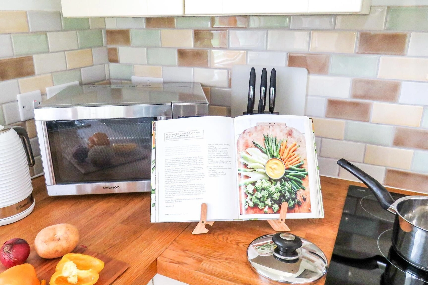 The bright and airy open-plan kitchen in our Norfolk lodges, perfect for preparing meals and socialising with family and friends during your self-catering getaway at Hays Wood Retreat.